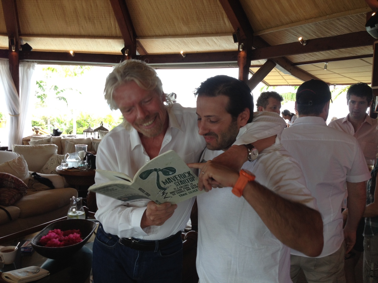 Yanik pitching Richard Branson with the Maverick Startup book
