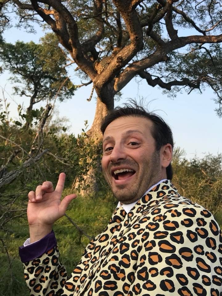 Yanik in a leopard blazer on safari